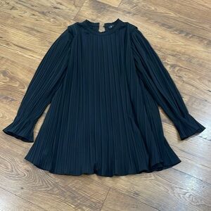Black long sleeved pleated dress